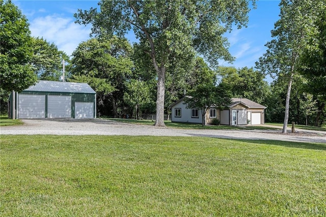 1433 Haskell Rd, Williamsburg, KS 66095 - view of grassy yard with an outbuilding, view of scattered trees, and a garage