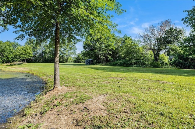 1433 Haskell Rd, Williamsburg, KS 66095 - view of grassy yard with a storage shed