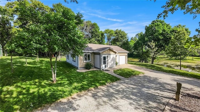 1433 Haskell Rd, Williamsburg, KS 66095 - ranch-style house featuring driveway, a garage, and a front lawn