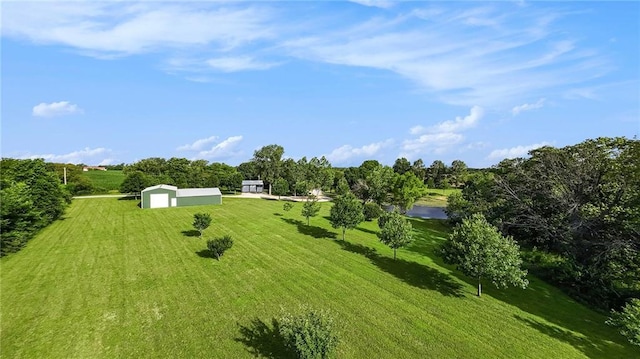 1433 Haskell Rd, Williamsburg, KS 66095 - view of grassy yard with an outdoor structure, a detached garage, a pole building, and driveway