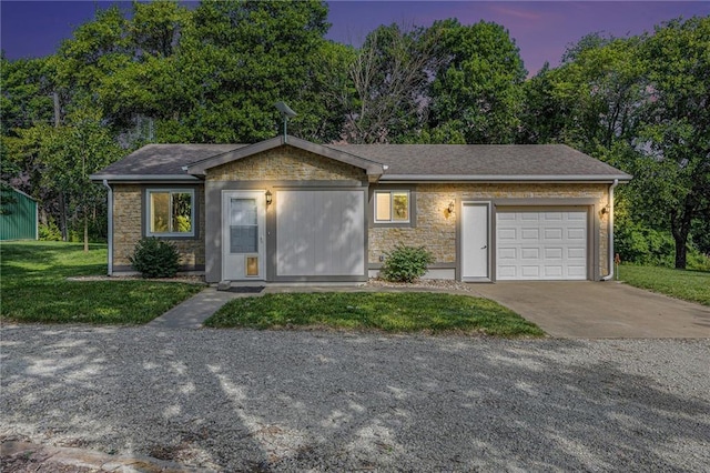 1433 Haskell Rd, Williamsburg, KS 66095 - ranch-style home featuring stone siding, concrete driveway, a garage, and a front yard