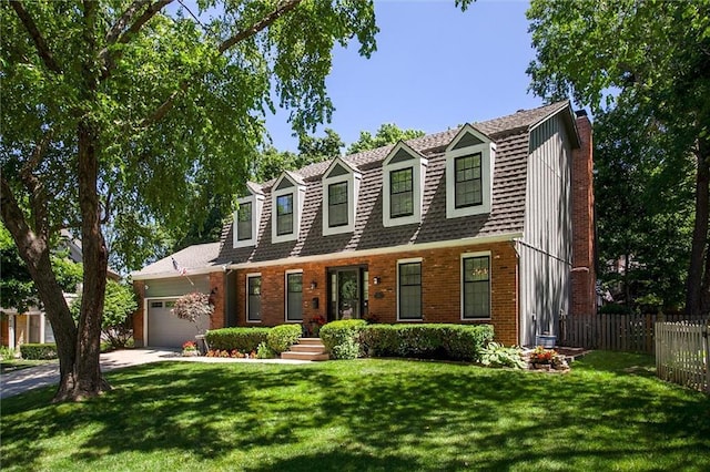 9718 W 115th Ter, Overland Park, KS 66210 - view of front of property with a gambrel roof, a chimney, an attached garage, and brick siding
