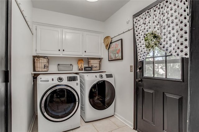 9718 W 115th Ter, Overland Park, KS 66210 - laundry area with washer and clothes dryer, cabinet space, and light tile patterned floors