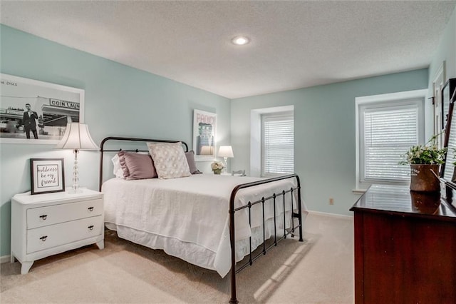 9718 W 115th Ter, Overland Park, KS 66210 - bedroom with light colored carpet, a textured ceiling, and recessed lighting