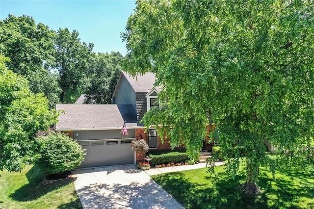 9718 W 115th Ter, Overland Park, KS 66210 - view of front of house with a garage, a front yard, and concrete driveway