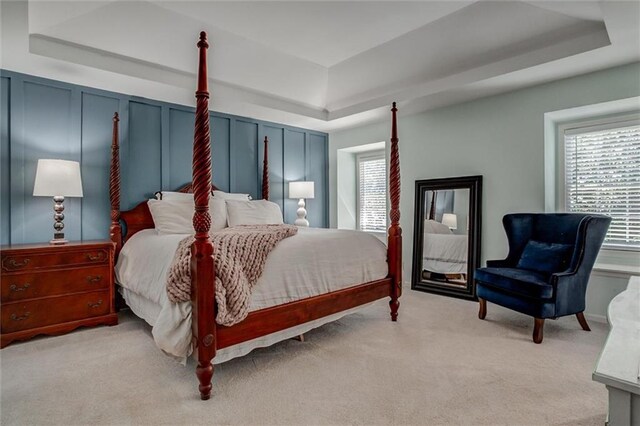 9718 W 115th Ter, Overland Park, KS 66210 - bedroom featuring a tray ceiling and carpet flooring