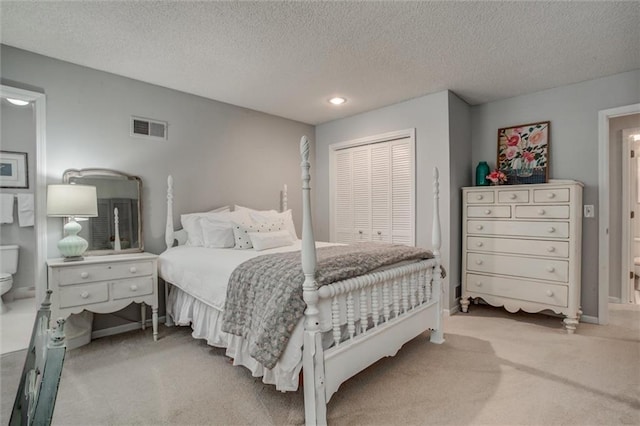 9718 W 115th Ter, Overland Park, KS 66210 - bedroom with carpet floors, a textured ceiling, recessed lighting, and a closet