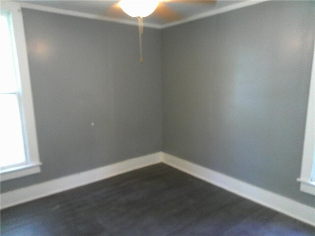 1022 Sycamore St, Humboldt, KS 66748 - unfurnished room with ceiling fan and dark wood-style flooring