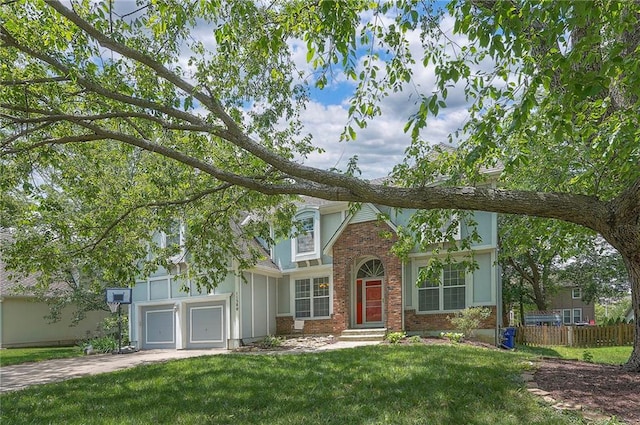 11580 S Skyview Ln, Olathe, KS 66061 - english style home with brick siding, concrete driveway, and a garage