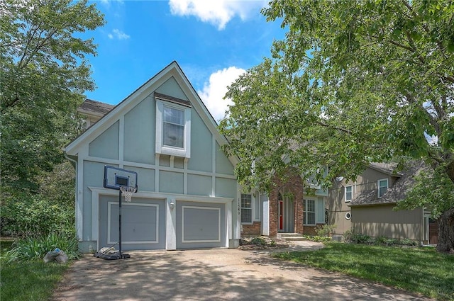11580 S Skyview Ln, Olathe, KS 66061 - english style home featuring stucco siding, driveway, and an attached garage