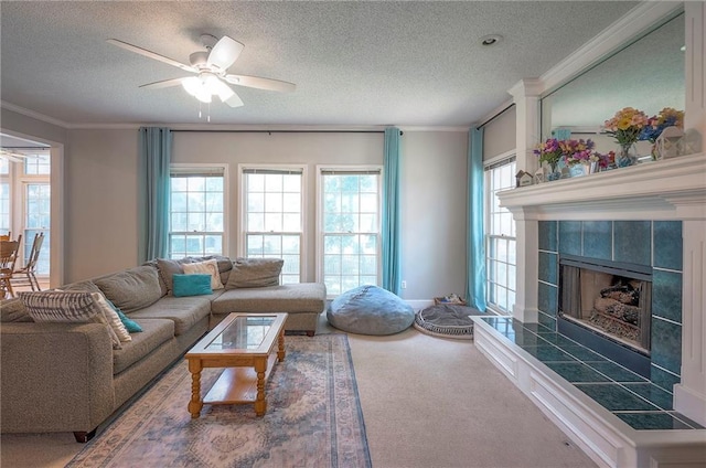 11580 S Skyview Ln, Olathe, KS 66061 - carpeted living room with a ceiling fan, a textured ceiling, ornamental molding, and a fireplace