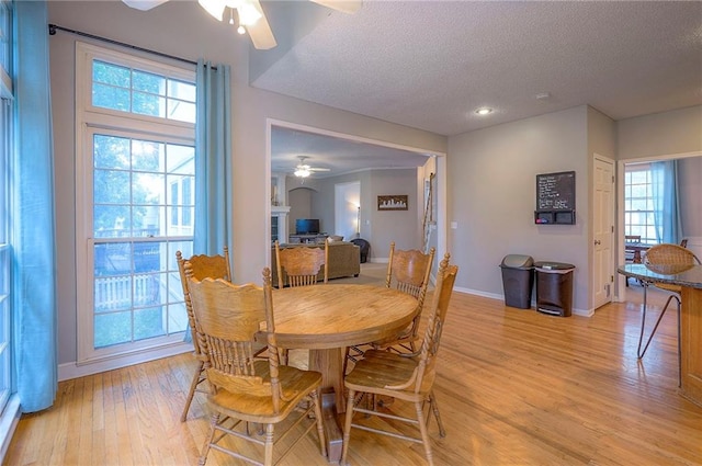 11580 S Skyview Ln, Olathe, KS 66061 - dining space featuring a ceiling fan, a textured ceiling, light wood finished floors, healthy amount of natural light, and recessed lighting