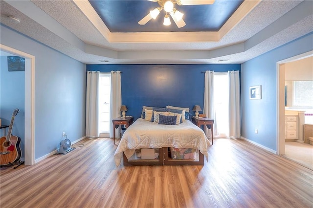 11580 S Skyview Ln, Olathe, KS 66061 - bedroom with a raised ceiling, wood finished floors, and multiple windows