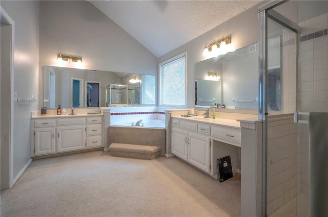 11580 S Skyview Ln, Olathe, KS 66061 - full bathroom featuring two vanities, a stall shower, a bath, and lofted ceiling