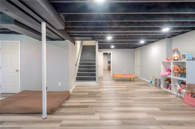 11580 S Skyview Ln, Olathe, KS 66061 - finished basement featuring wood finished floors and stairs