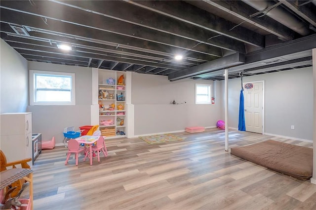 11580 S Skyview Ln, Olathe, KS 66061 - rec room with wood finished floors and baseboards