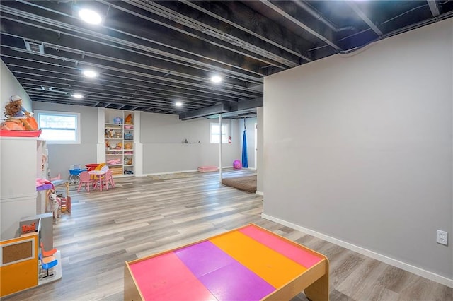 11580 S Skyview Ln, Olathe, KS 66061 - playroom with plenty of natural light and wood finished floors
