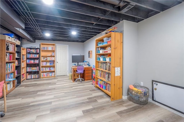 11580 S Skyview Ln, Olathe, KS 66061 - finished basement with light wood-style floors, a desk, and recessed lighting