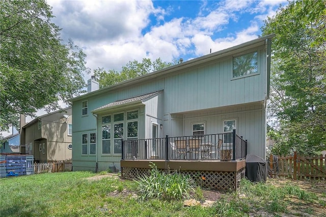 11580 S Skyview Ln, Olathe, KS 66061 - back of property featuring a wooden deck and a chimney