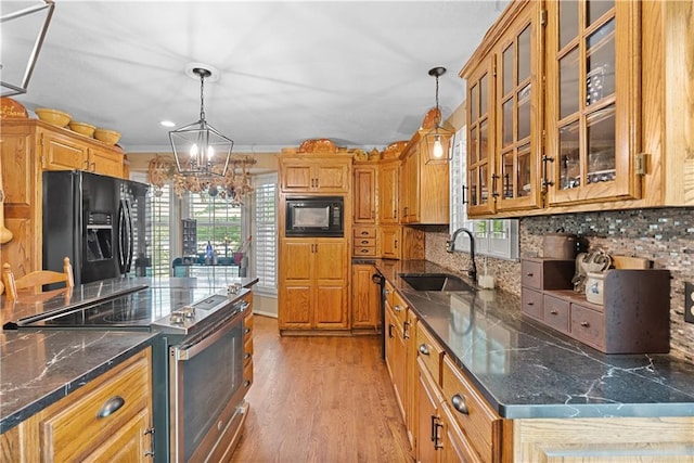 200 NE Oak Tree Cir, Lees Summit, MO 64086 - kitchen featuring black appliances, tasteful backsplash, a chandelier, and decorative light fixtures
