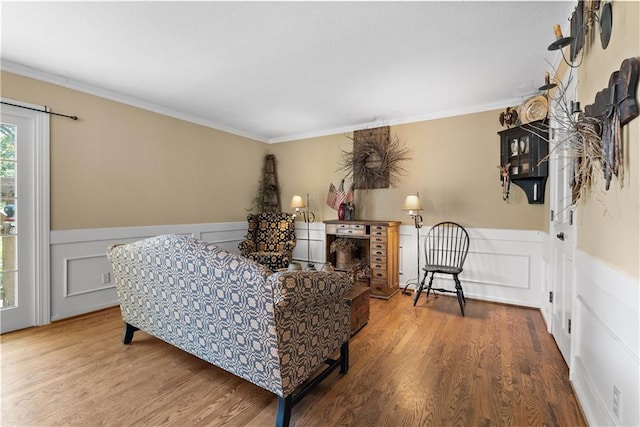 200 NE Oak Tree Cir, Lees Summit, MO 64086 - bedroom with a wainscoted wall, a decorative wall, wood finished floors, and ornamental molding
