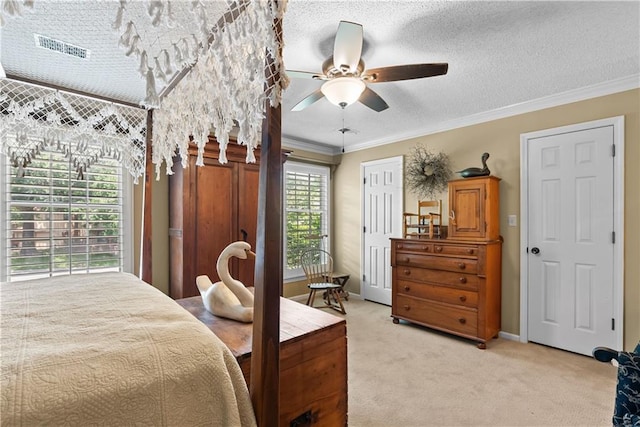200 NE Oak Tree Cir, Lees Summit, MO 64086 - bedroom with light colored carpet, crown molding, a textured ceiling, and a ceiling fan