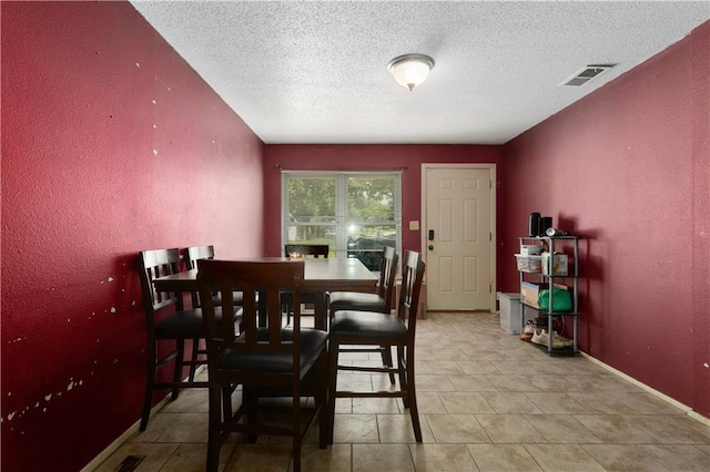 2716 S 52nd St, Kansas City, KS 66106 - dining area with a textured wall and a textured ceiling