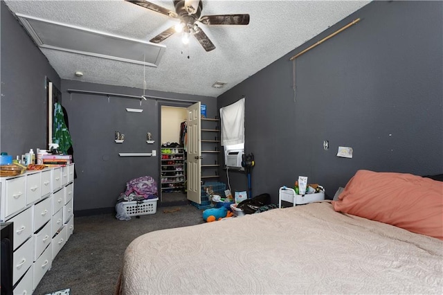 2716 S 52nd St, Kansas City, KS 66106 - bedroom with attic access, a textured ceiling, dark colored carpet, ceiling fan, and a spacious closet