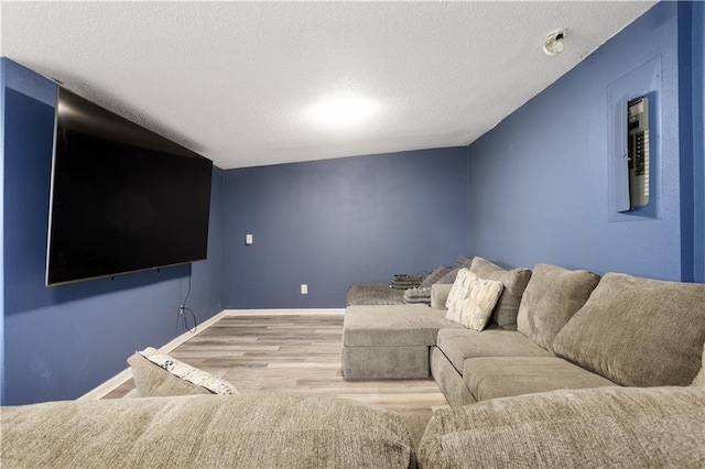 2716 S 52nd St, Kansas City, KS 66106 - living room with wood finished floors and a textured ceiling
