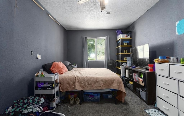 2716 S 52nd St, Kansas City, KS 66106 - bedroom featuring carpet flooring, a textured ceiling, a textured wall, and a ceiling fan