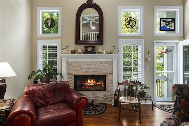 5817 Park Cir, Shawnee, KS 66216 - living room with a ceiling fan, wood finished floors, and a fireplace