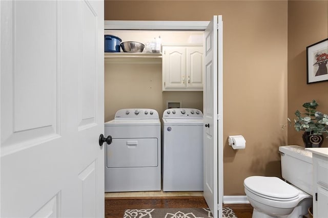 5817 Park Cir, Shawnee, KS 66216 - laundry room with washing machine and dryer, cabinet space, and dark wood finished floors