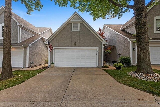 5817 Park Cir, Shawnee, KS 66216 - traditional home with a garage and stucco siding