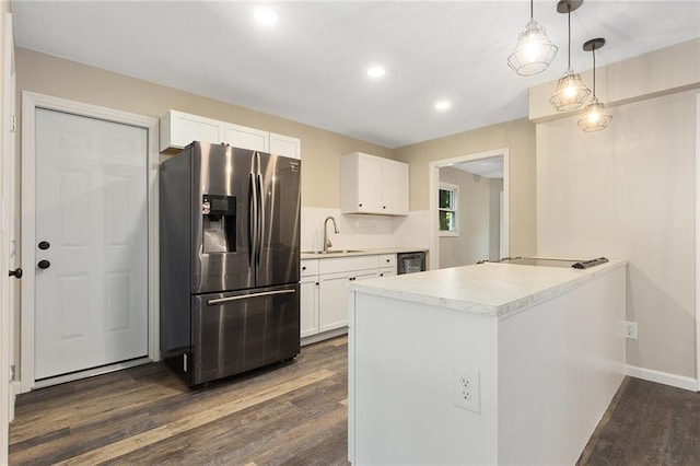 7421 NW 76th Ter, Kansas City, MO 64152 - kitchen with stainless steel fridge, dark wood finished floors, white cabinets, dishwashing machine, and black electric stovetop