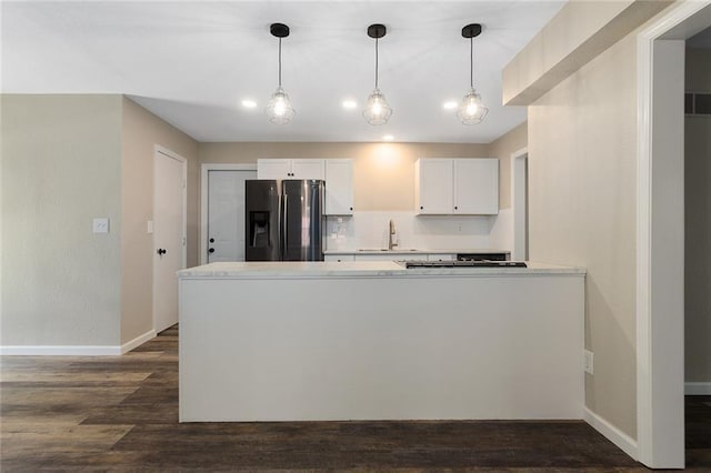 7421 NW 76th Ter, Kansas City, MO 64152 - kitchen featuring refrigerator with ice dispenser, white cabinets, dark wood-type flooring, a peninsula, and light countertops