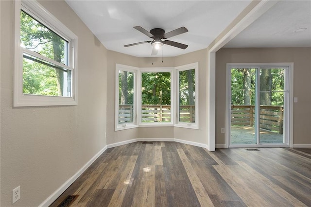 7421 NW 76th Ter, Kansas City, MO 64152 - unfurnished room with ceiling fan, plenty of natural light, and wood finished floors