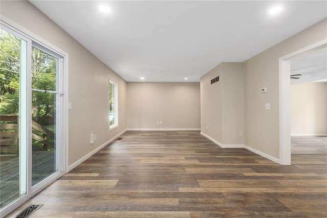 7421 NW 76th Ter, Kansas City, MO 64152 - spare room featuring healthy amount of natural light, wood finished floors, and recessed lighting