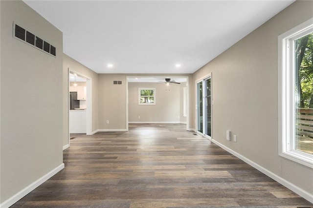 7421 NW 76th Ter, Kansas City, MO 64152 - spare room featuring wood finished floors, a ceiling fan, and recessed lighting