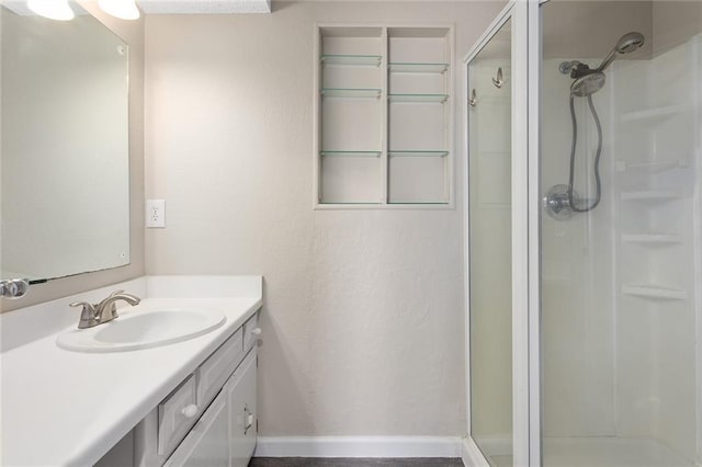 7421 NW 76th Ter, Kansas City, MO 64152 - bathroom featuring a stall shower, vanity, and a textured wall