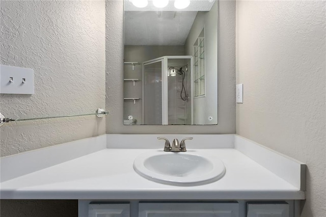7421 NW 76th Ter, Kansas City, MO 64152 - full bathroom featuring a stall shower, vanity, and a textured wall