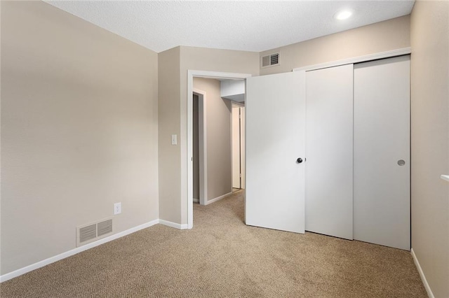 7421 NW 76th Ter, Kansas City, MO 64152 - unfurnished bedroom featuring light colored carpet, a closet, and recessed lighting
