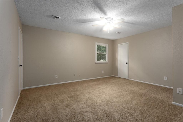 7421 NW 76th Ter, Kansas City, MO 64152 - spare room featuring carpet, ceiling fan, and a textured ceiling