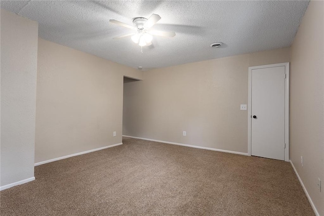 7421 NW 76th Ter, Kansas City, MO 64152 - spare room featuring ceiling fan, carpet flooring, and a textured ceiling