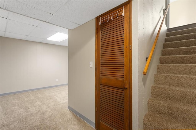 7421 NW 76th Ter, Kansas City, MO 64152 - stairway featuring carpet and a paneled ceiling