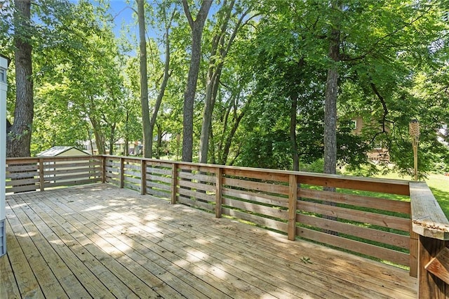 7421 NW 76th Ter, Kansas City, MO 64152 - wooden deck with view of wooded area