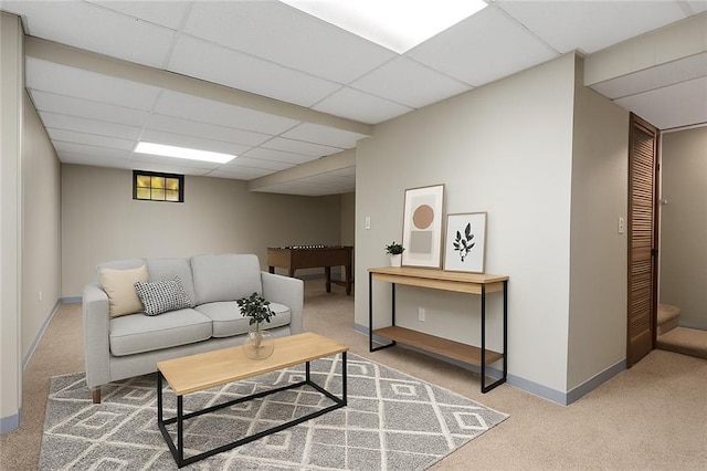 7421 NW 76th Ter, Kansas City, MO 64152 - living room featuring carpet and a paneled ceiling