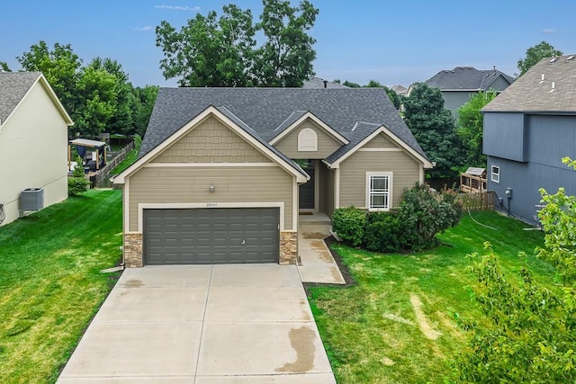 20444 W 125th Ter, Olathe, KS 66061 - view of front facade with a front lawn, stone siding, roof with shingles, a garage, and concrete driveway