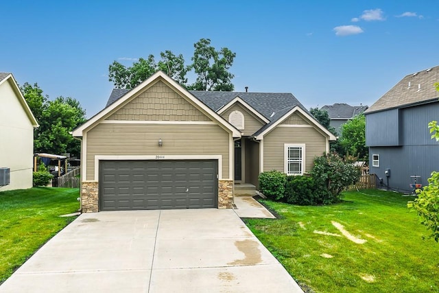 20444 W 125th Ter, Olathe, KS 66061 - craftsman-style home with a front lawn, stone siding, and an attached garage