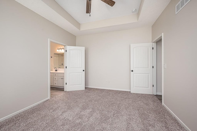 20444 W 125th Ter, Olathe, KS 66061 - unfurnished bedroom featuring light carpet, ensuite bath, and ceiling fan
