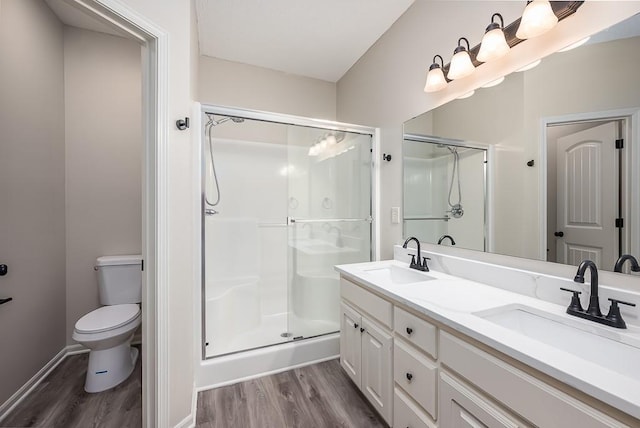 20444 W 125th Ter, Olathe, KS 66061 - bathroom with wood finished floors, double vanity, and a shower stall